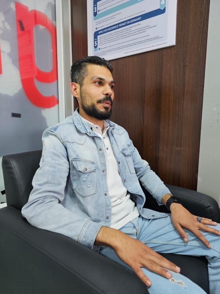  Profile of a man sitting in an office. 